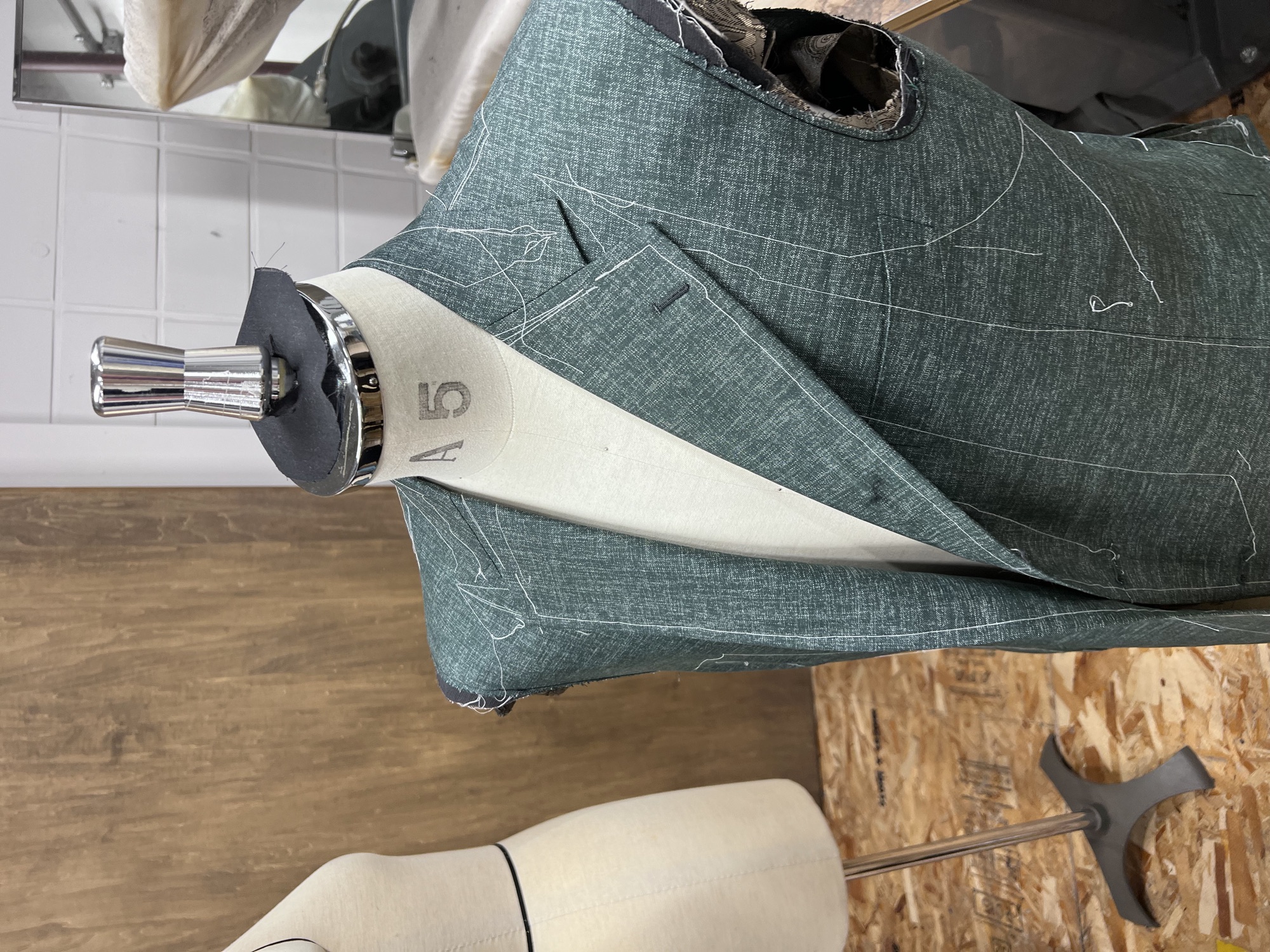 A basted jacket in progress on a tailor's form at Five One Factory, Hirakata